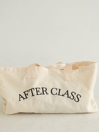 The After Class natural cotton-canvas tote, front view with 'AFTER CLASS' in black serif type