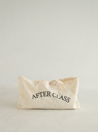 The After Class tote in natural cotton canvas with arched black 'AFTER CLASS' lettering